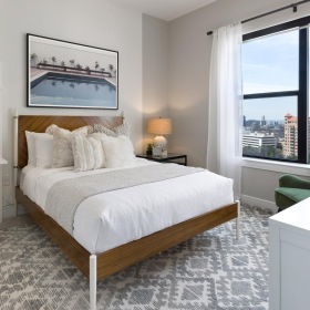 a bedroom with a large window